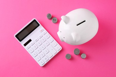 Photo of Financial savings. Piggy bank, coins and calculator on pink background, flat lay