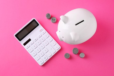 Financial savings. Piggy bank, coins and calculator on pink background, flat lay