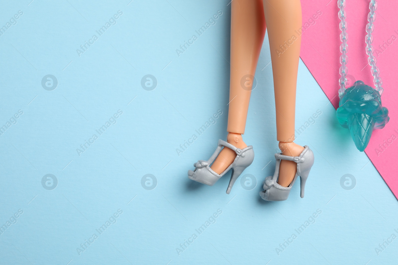 Photo of Mykolaiv, Ukraine - September 4, 2023: Barbie doll in beautiful heels with bag on color background, closeup. Space for text