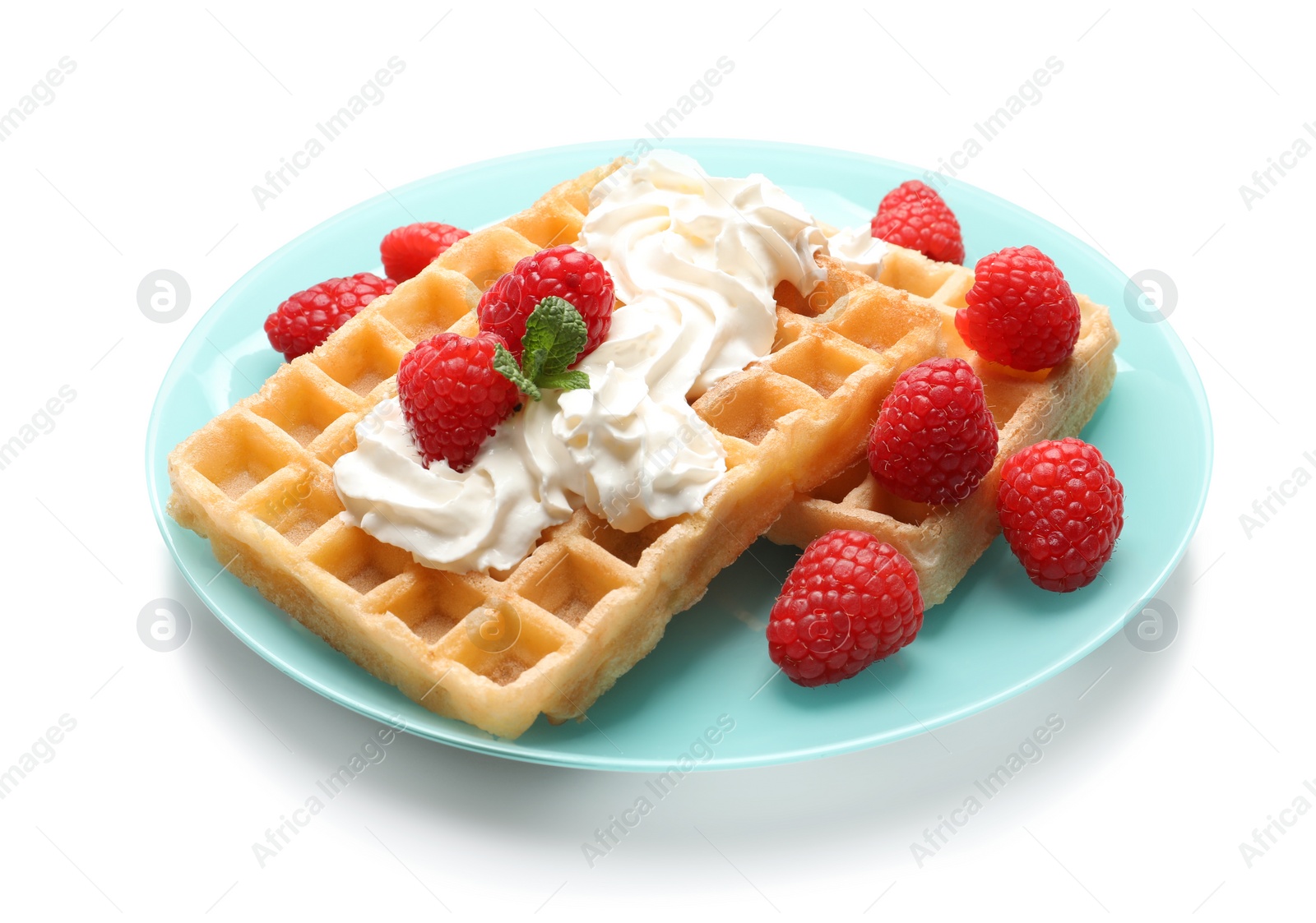 Photo of Plate with yummy waffles, whipped cream and raspberries on white background