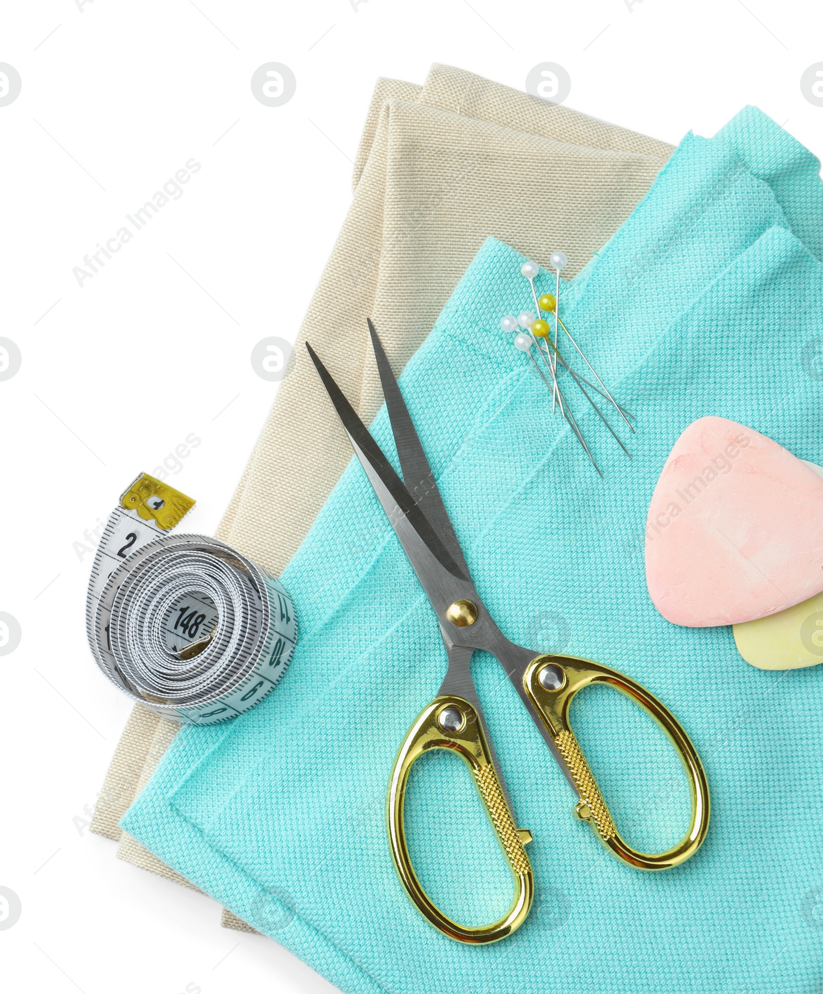 Photo of Scissors and sewing tools on white background, top view