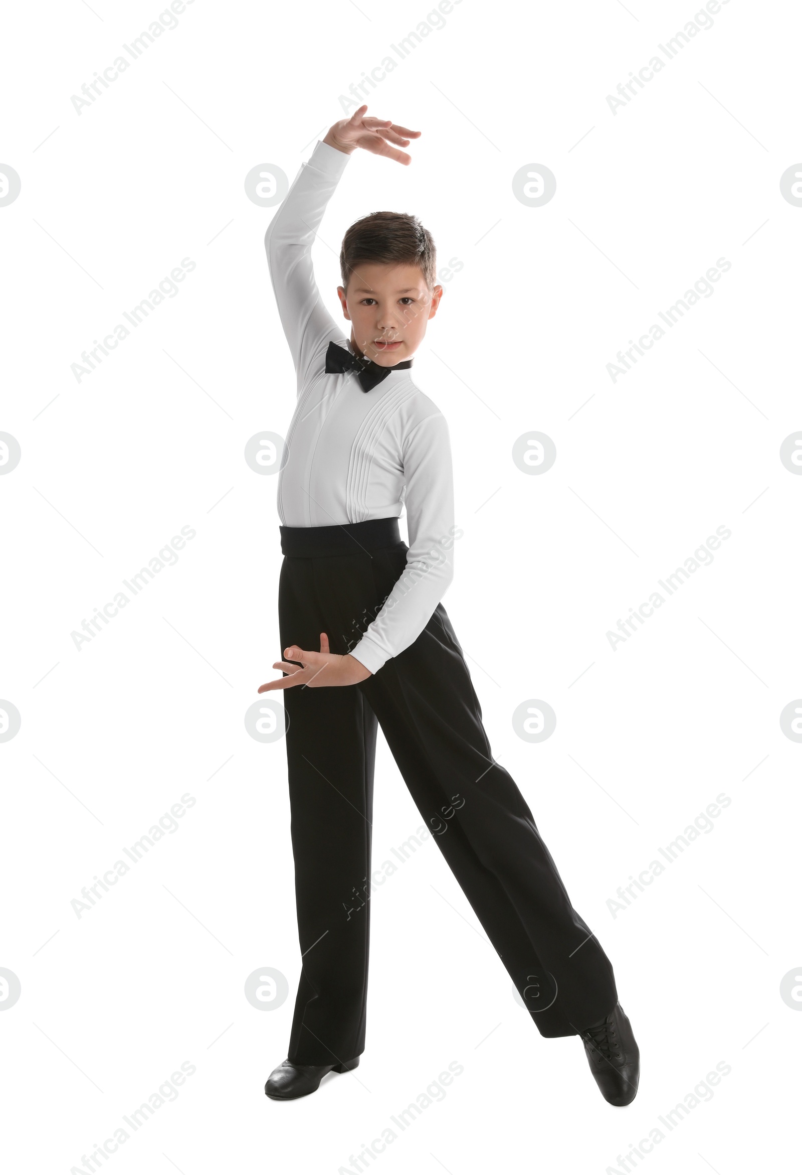 Photo of Beautifully dressed little boy dancing on white background