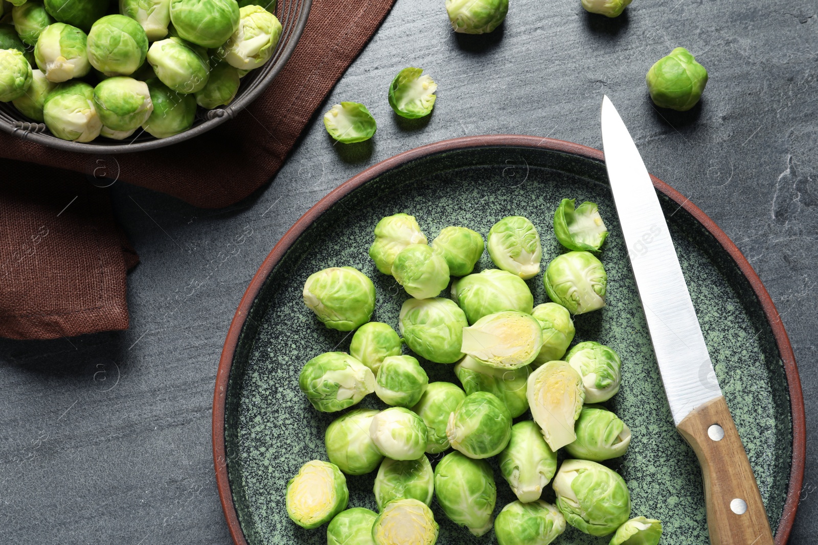 Photo of Plate with fresh Brussels sprouts on table, top view