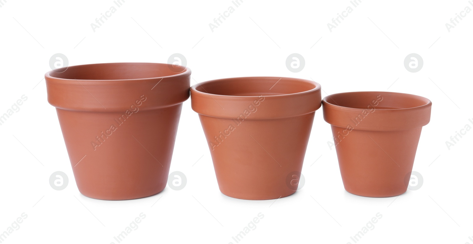 Photo of Stylish terracotta flower pots isolated on white