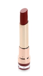 Photo of Beautiful lipstick on white background. Trendy makeup product