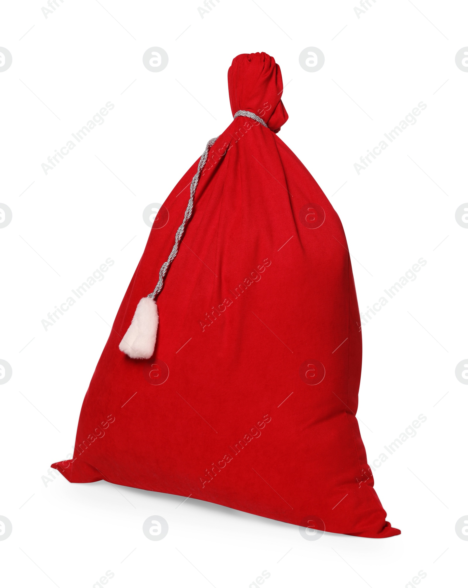 Photo of Merry Christmas. Santa Claus red bag isolated on white