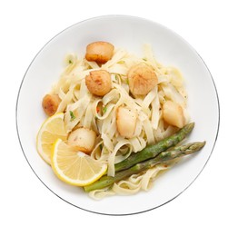 Photo of Delicious scallop pasta with asparagus and lemon isolated on white, top view