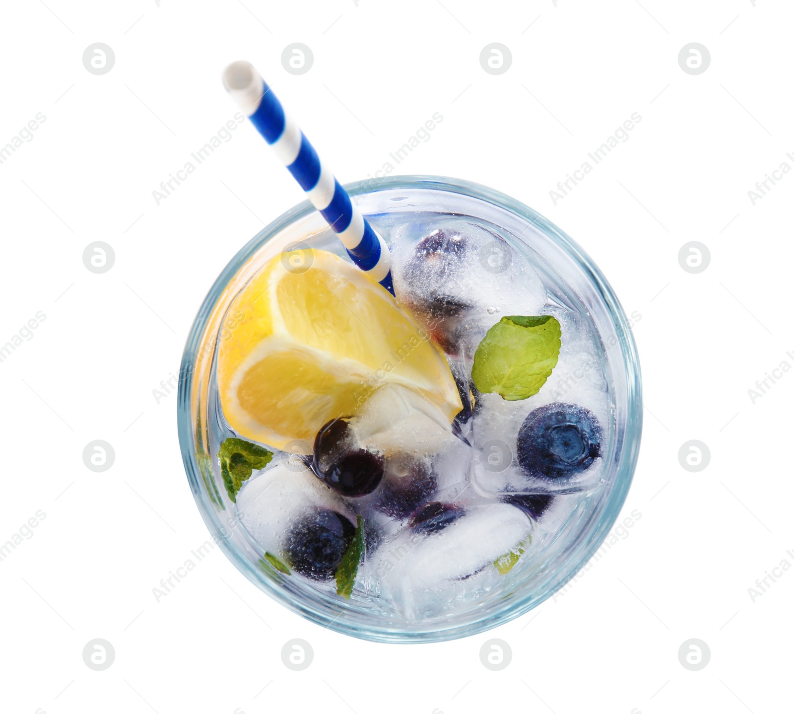 Photo of Glass of drink with blueberry ice cubes isolated on white, top view