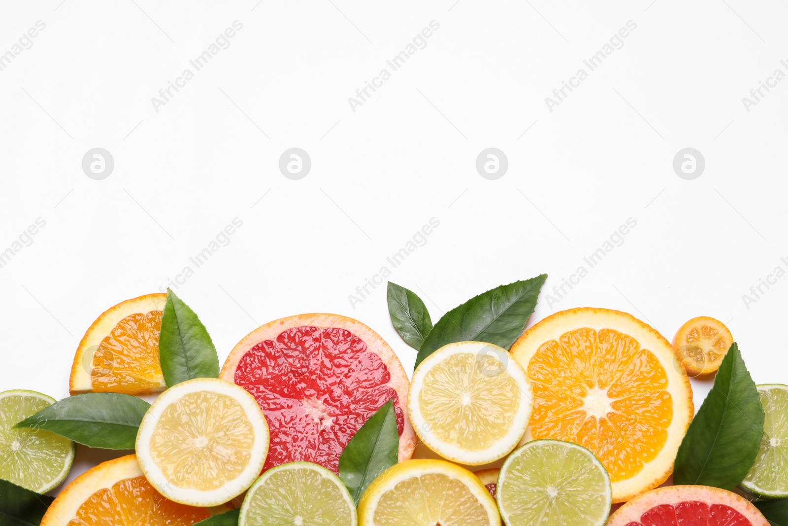 Photo of Fresh juicy citrus fruits with green leaves on white background, flat lay. Space for text