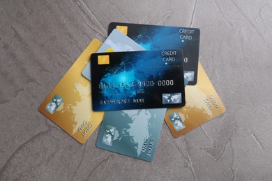 Credit cards on grey textured table, flat lay