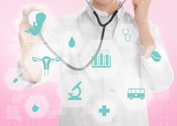Image of Doctor pointing at different virtual icons on pink background. Reproductive medicine concept