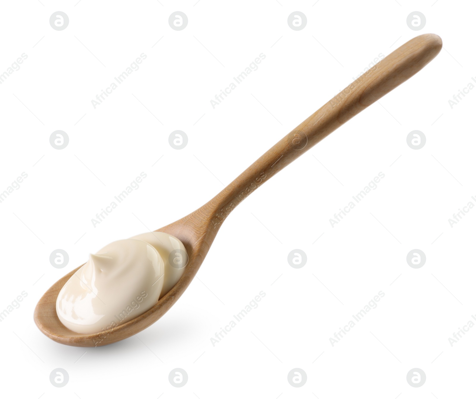 Photo of Natural yogurt in wooden spoon isolated on white