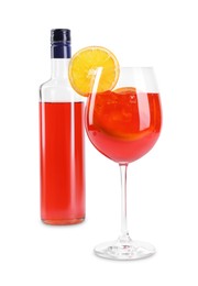Photo of Bottle and glass of tasty Aperol spritz cocktail isolated on white