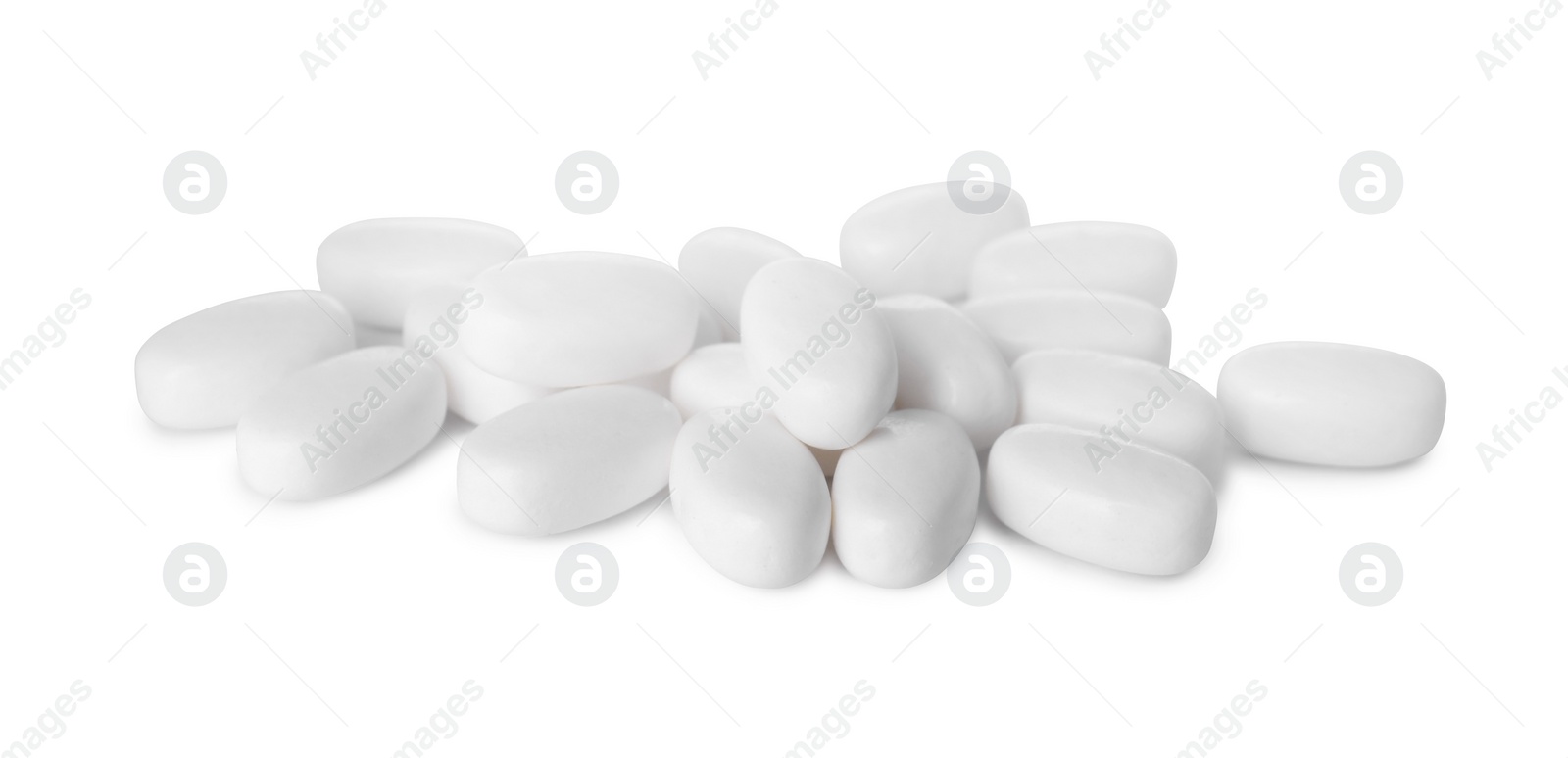 Photo of Tasty mint dragee candies on white background