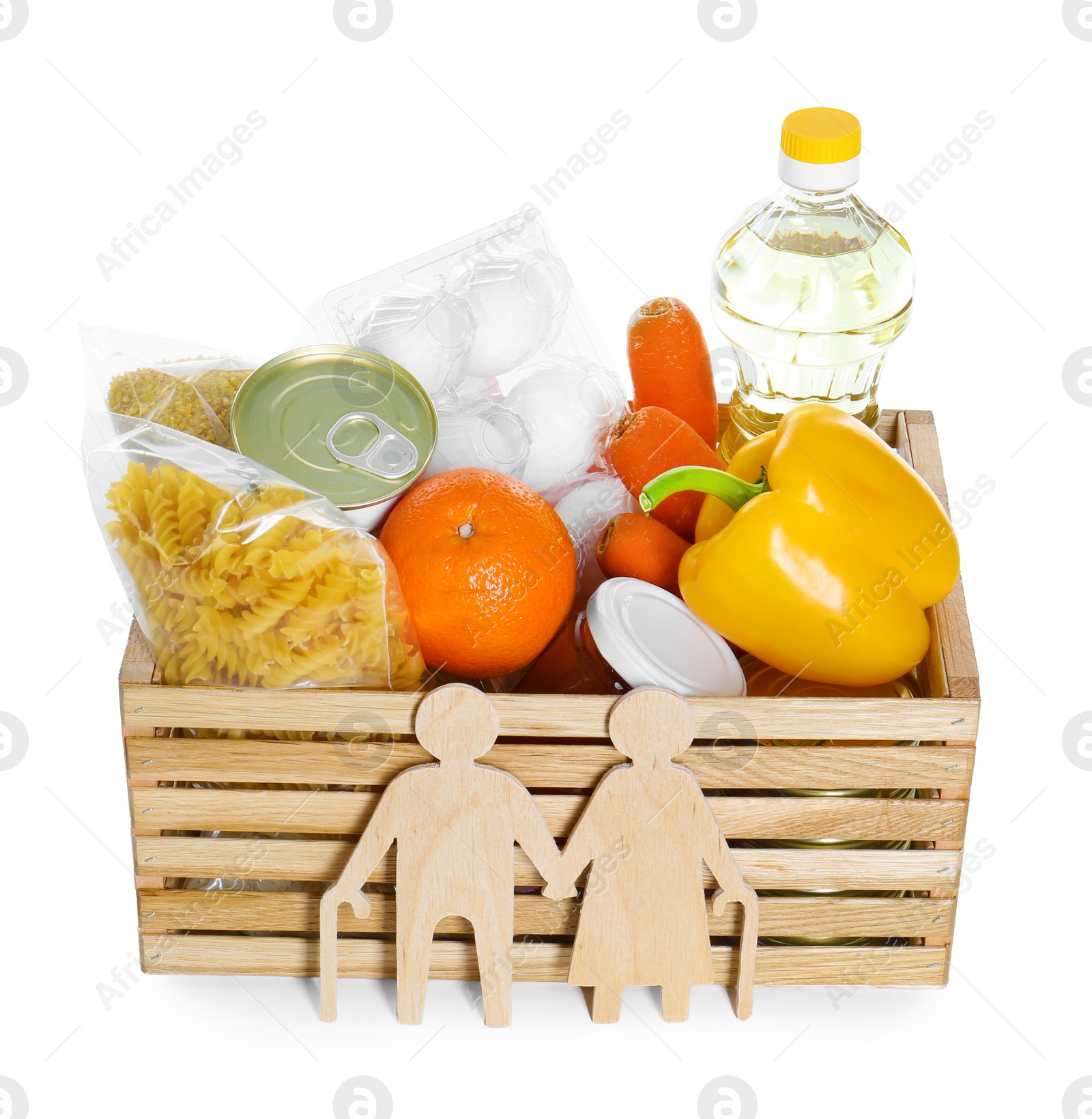 Photo of Humanitarian aid for elderly people. Wooden crate with donation food and figures of couple isolated on white