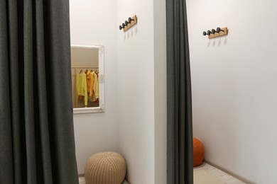 Photo of Dressing room in fashion store. Stylish design