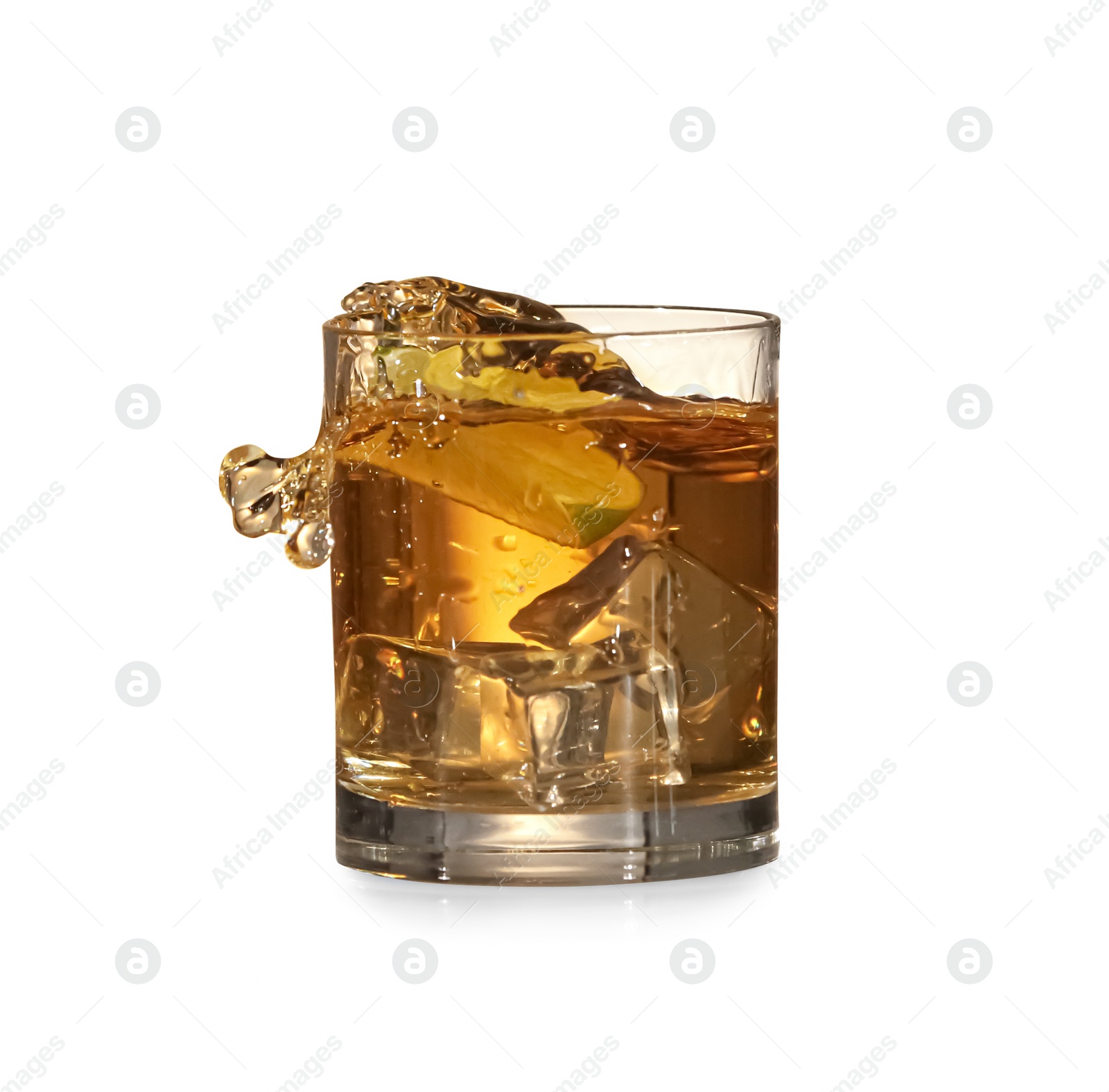 Photo of Whiskey splashing out of glass on white background