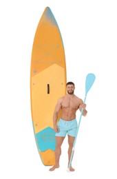 Photo of Happy man with orange SUP board and paddle on white background