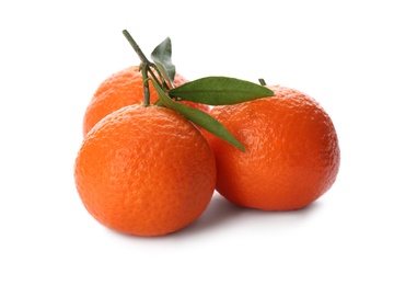 Photo of Whole fresh tangerines with green leaves on white background