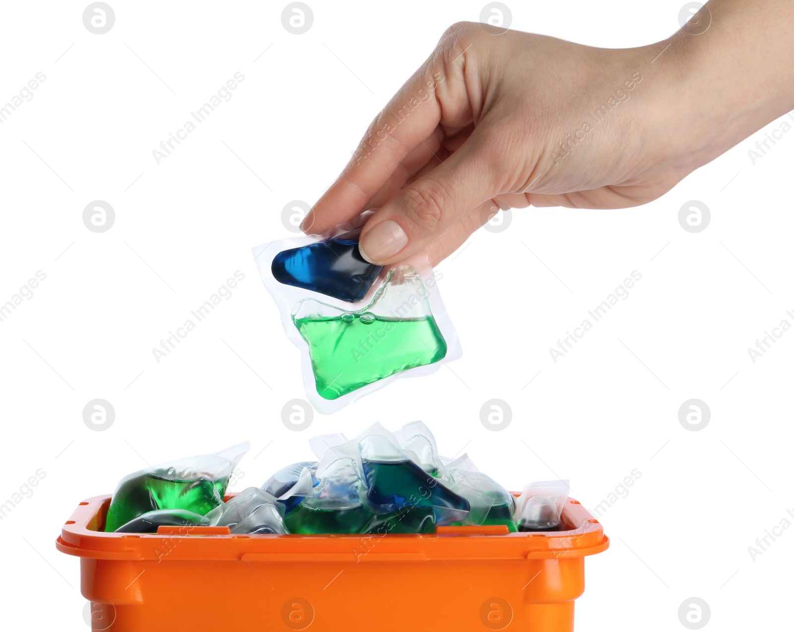 Photo of Woman taking laundry capsule out of box against white background, closeup