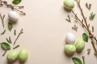 Photo of Flat lay composition with painted Easter eggs on color background, space for text