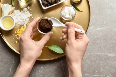 Photo of Woman preparing natural body scrub