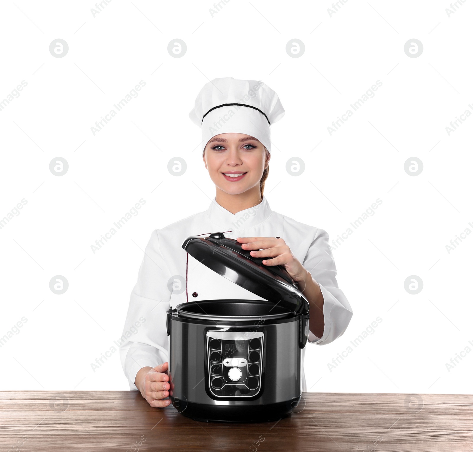 Photo of Female chef with modern multi cooker at table against white background