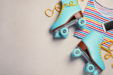 Photo of Flat lay composition with quad roller skates and space for text on light background