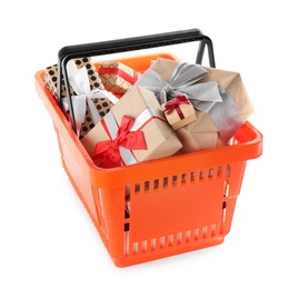 Photo of Orange shopping basket with different gifts on white background