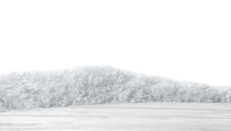 Wooden surface covered with snow against white background