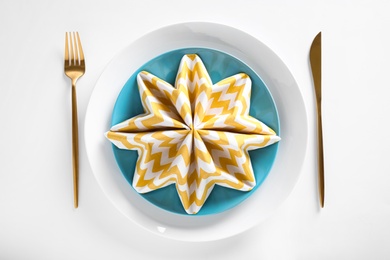 Elegant table setting on white background, top view