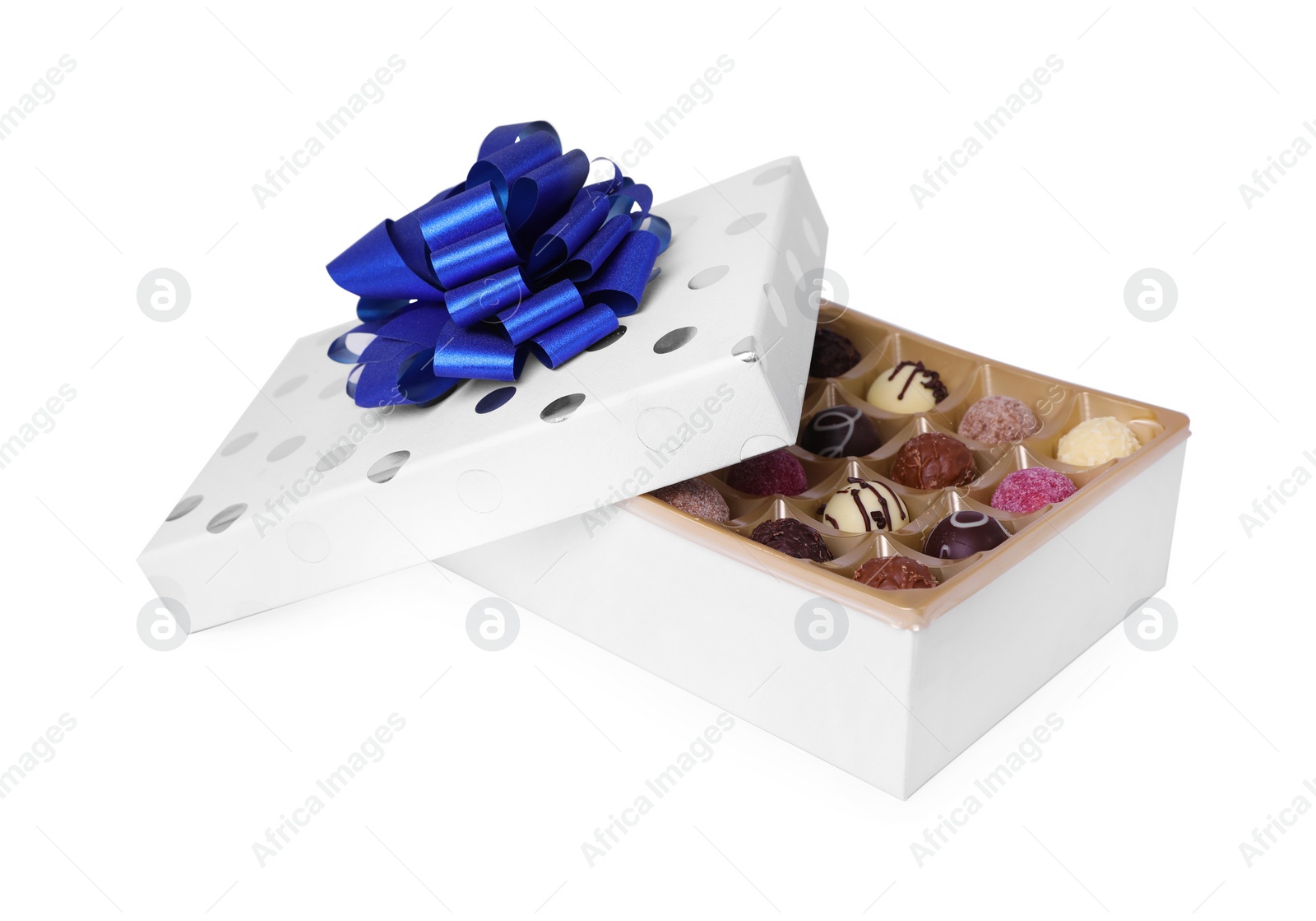 Photo of Box with tasty chocolate candies isolated on white