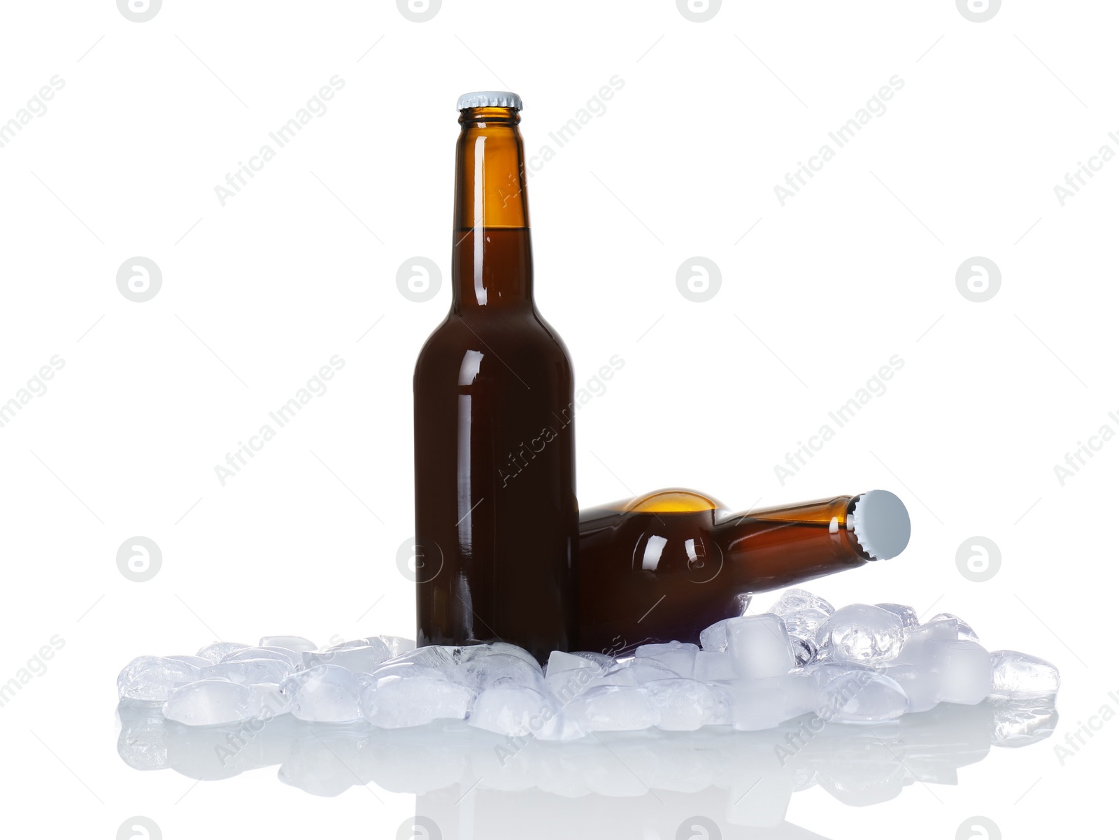 Photo of Bottles of beer and ice cubes on white background