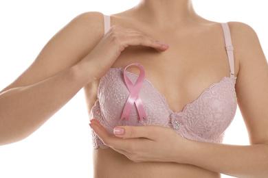 Photo of Woman with pink ribbon on white background, closeup. Breast cancer awareness