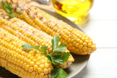 Photo of Tasty grilled corn with parmesan, closeup view