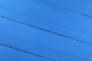 Photo of Texture of dark blue wooden surface as background, closeup