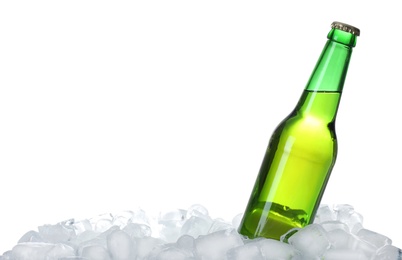 Photo of Bottle of beer on ice cubes against white background
