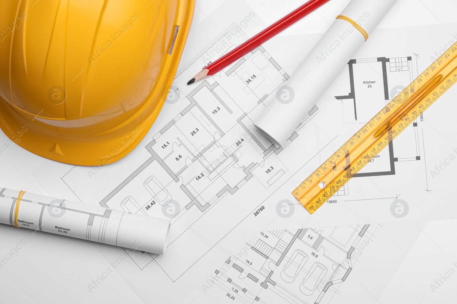 Photo of Flat lay composition with blueprints and hardhat on white background