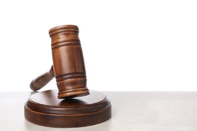 Photo of Wooden gavel on light table against white background. Space for text