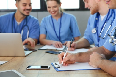 Photo of Medical students studying at university, closeup view