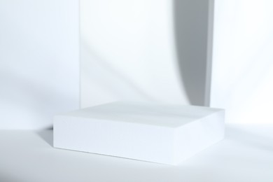 Presentation of product. Podium on white background, space for text