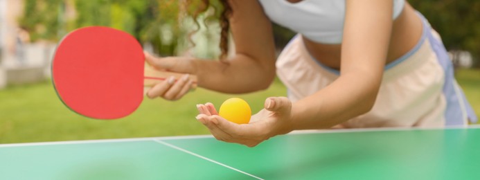 Image of African-American woman playing ping pong outdoors, closeup. Banner design