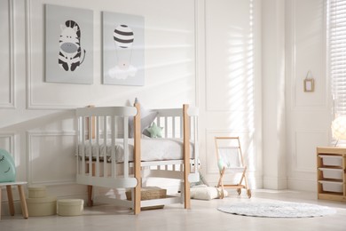 Photo of Baby room interior with stylish furniture and toys