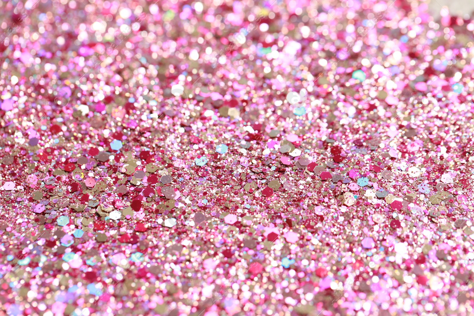 Photo of Beautiful pink shiny glitter as background, closeup