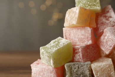 Tasty turkish delight dessert on table, closeup. Space for text