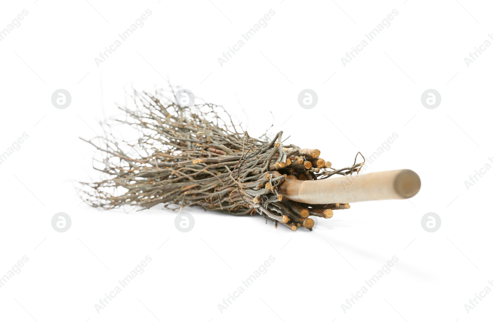 Photo of Old broom with wooden handle isolated on white