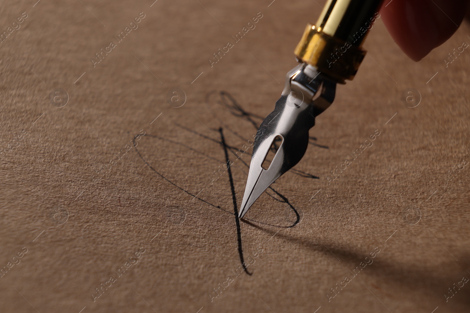 Photo of Woman signing on sheet of paper with fountain pen, closeup. Space for text