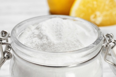 Jar with baking soda on table, closeup