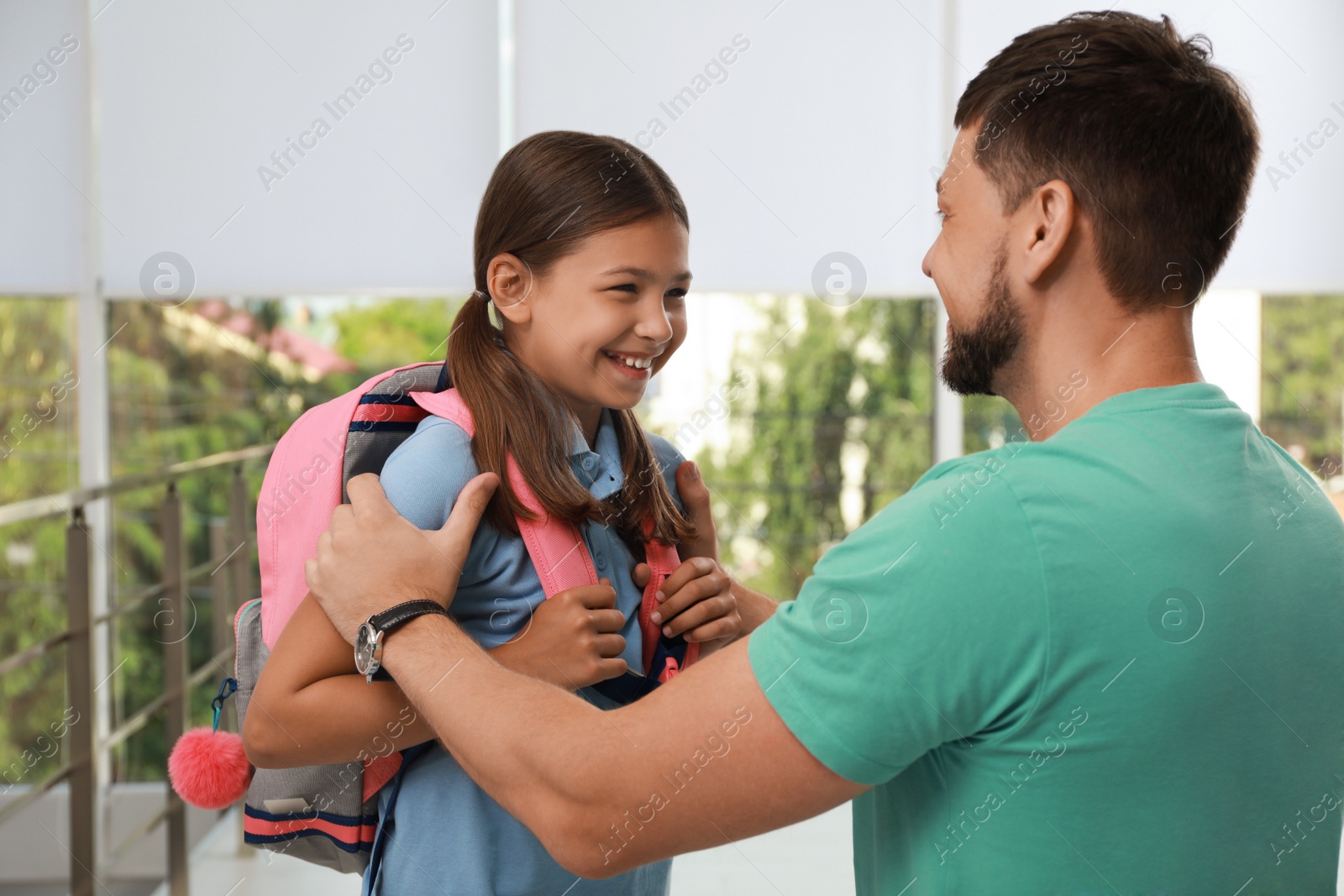 Photo of Father saying goodbye to his daughter in school