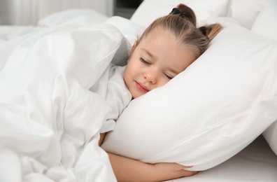 Beautiful little girl sleeping in bed. Bedtime schedule